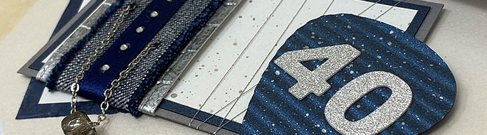 close up of birthday card for him with upcycled denim and chain in blue and silver
